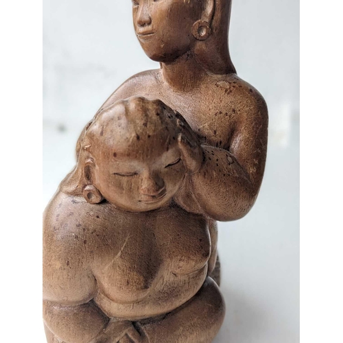 611 - Ida Bagus Tilem. Indonesian, 1936-1993, carved wood figure. Inscribed on base 'IDA BAGUS TILEM MAS B... 