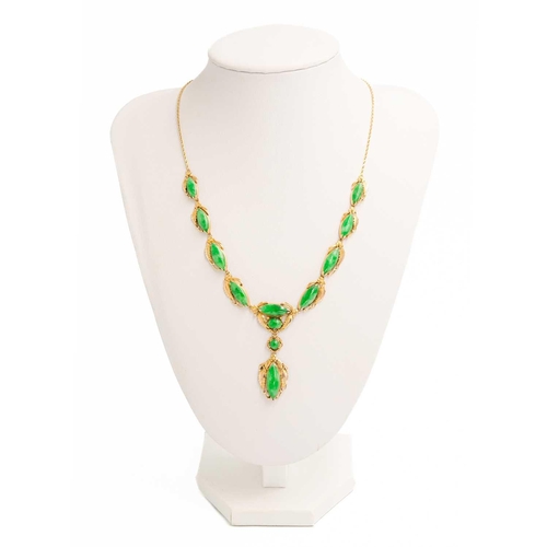 614 - An Art Nouveau jade and 14ct mounted necklace, with enclosed back and stamped 14k. Length 24.5cm.