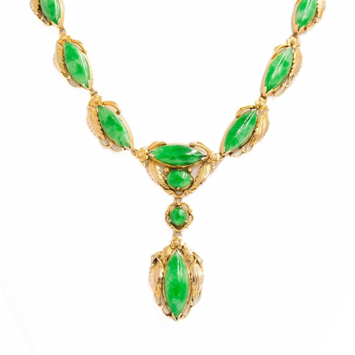 614 - An Art Nouveau jade and 14ct mounted necklace, with enclosed back and stamped 14k. Length 24.5cm.