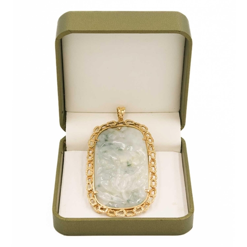 615 - A carved jade and 9ct mounted pendant. 9 x 4.8cm, 54 grams.