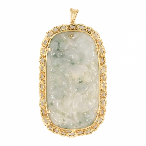 615 - A carved jade and 9ct mounted pendant. 9 x 4.8cm, 54 grams.