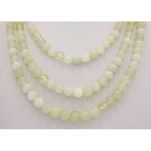 616 - A green hardstone necklace, with 9ct gold clasp. Length 67.5cm, 96 grams.