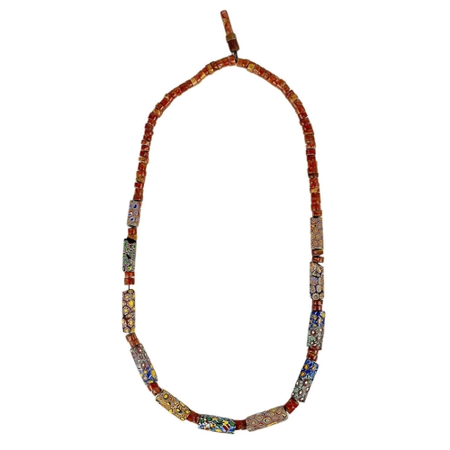 619 - A Tibetan necklace. Length 35cm; a cultured pearl necklace, length 33.5cm; and an African necklace, ... 