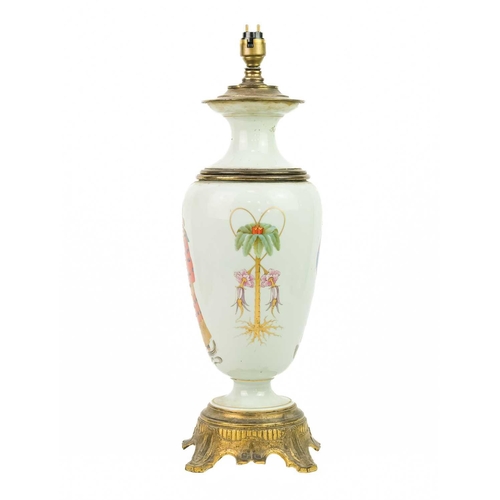 635 - A porcelain and gilt metal oil lamp, late 19th century. Coverted to a table lamp, painted and gilt d... 