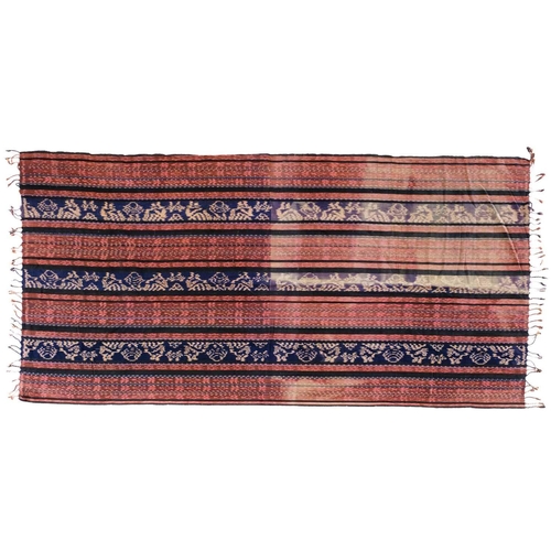 636 - A cotton Ikat shawl, Sumba, East Indonesia, circa 1920's/30's. 223 x 112cm.