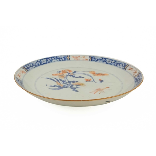 64 - A Chinese Imari porcelain shallow dish, 18th century. With floral spray to the centre, the blue and ... 