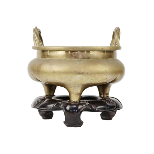 66 - A large Chinese bronze twin-handled tripod censer on stand, Qing Dynasty. Of compressed globular for... 