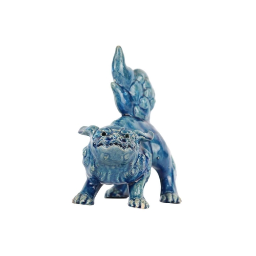 666 - A Chinese turquoise glazed pottery 'Lion' dog, late Qing Dynasty, circa 1900. Height 19cm, width 17c... 