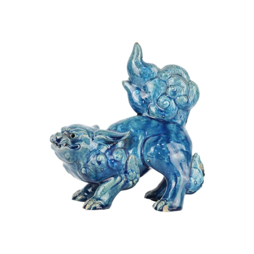 666 - A Chinese turquoise glazed pottery 'Lion' dog, late Qing Dynasty, circa 1900. Height 19cm, width 17c... 