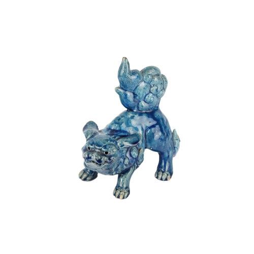 666 - A Chinese turquoise glazed pottery 'Lion' dog, late Qing Dynasty, circa 1900. Height 19cm, width 17c... 