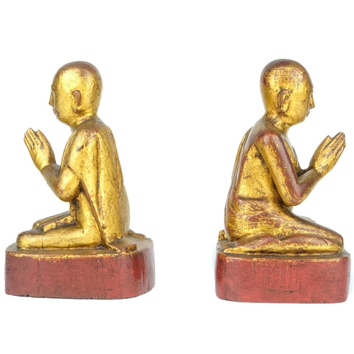 671 - Two Burmese gilt wood models of monks, 19th century. With inscriptions, height 18.5cm, width 9cm, de... 