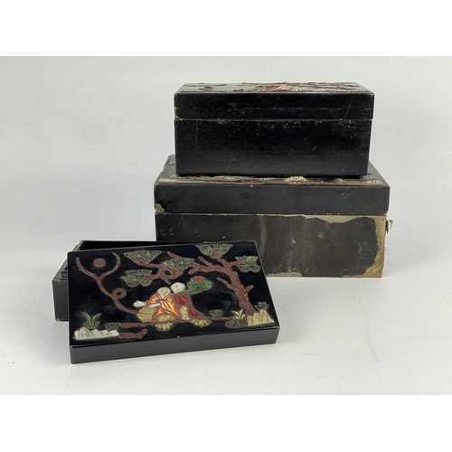 675 - Three Chinese black lacquer stacking boxes, early 20th century. Applied with hardstones, bone and mo... 