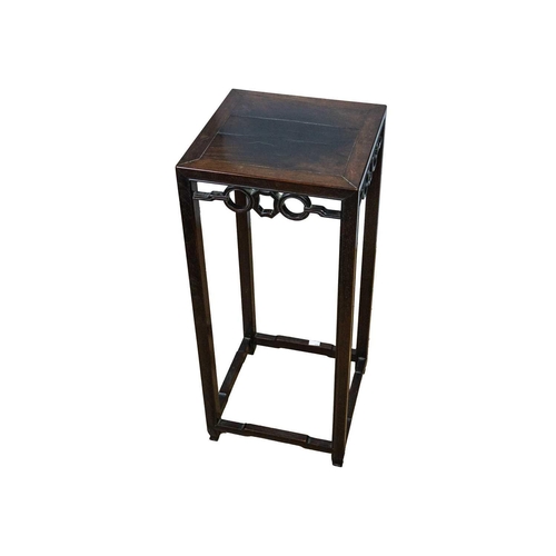 685 - A Chinese hardwood jardiniere stand, late 19th century. With a pierced apron on square section suppo... 