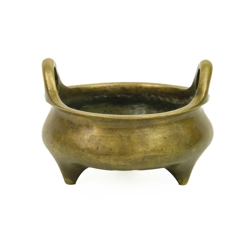 7 - A Chinese bronze censer, Qing Dynasty, 19th century. With a pair of loop handles and bulbous body, o... 