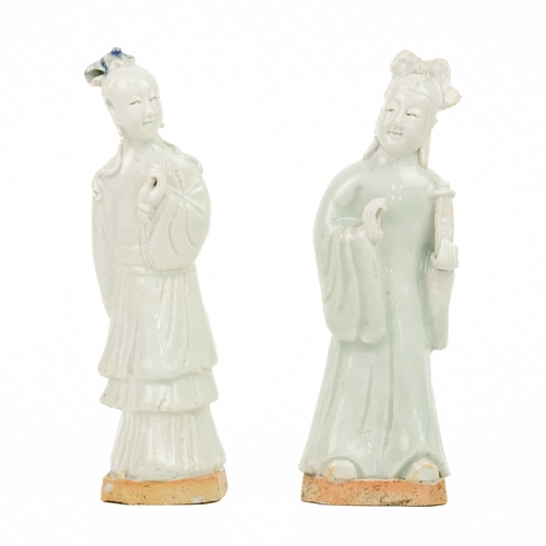 76 - A pair of Chinese celadon figures of attendants, 19th century. Height 18cm. (2) Provenance: The Mich... 