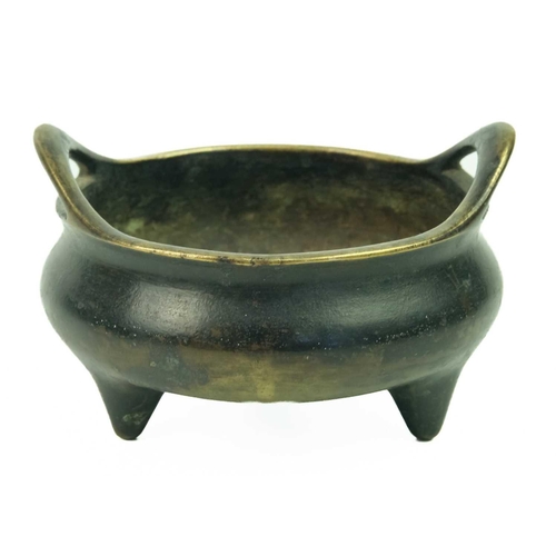 8 - A Chinese bronze censer, Qing Dynasty, 19th century. With a pair of flared loop handles, bulbous bod... 