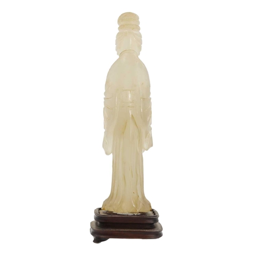 83 - A Chinese jade figure of a female immortal, Qing Dynasty, 19th century. The standing figure wearing ... 