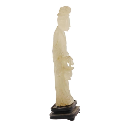 83 - A Chinese jade figure of a female immortal, Qing Dynasty, 19th century. The standing figure wearing ... 