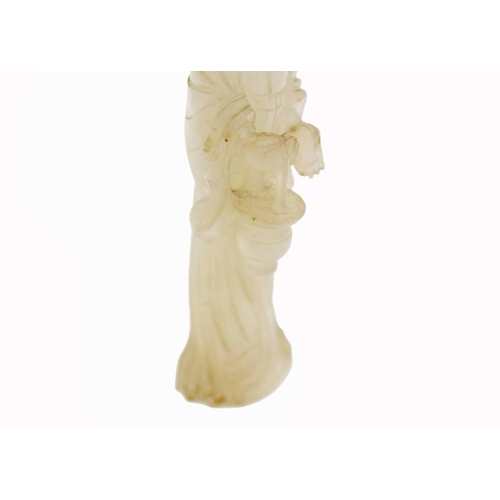 83 - A Chinese jade figure of a female immortal, Qing Dynasty, 19th century. The standing figure wearing ... 