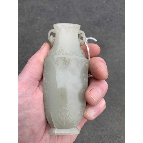 86 - A Chinese grey-green jade vase, Qing Dynasty, 18th/19th century. With attached circular paper label ... 