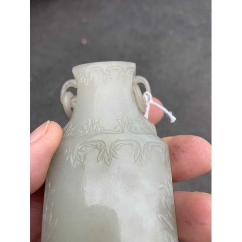 86 - A Chinese grey-green jade vase, Qing Dynasty, 18th/19th century. With attached circular paper label ... 