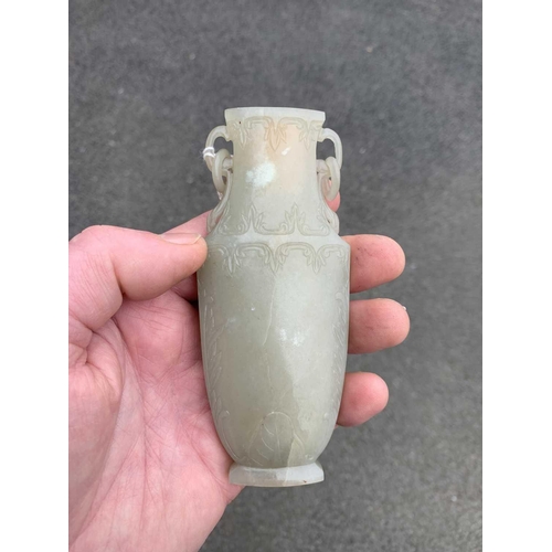 86 - A Chinese grey-green jade vase, Qing Dynasty, 18th/19th century. With attached circular paper label ... 