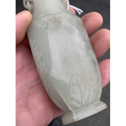 86 - A Chinese grey-green jade vase, Qing Dynasty, 18th/19th century. With attached circular paper label ... 