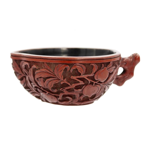 88 - A Chinese cinnabar lacquer libation cup, Qing Dynasty, 18th/19th century Carved with branches of fru... 