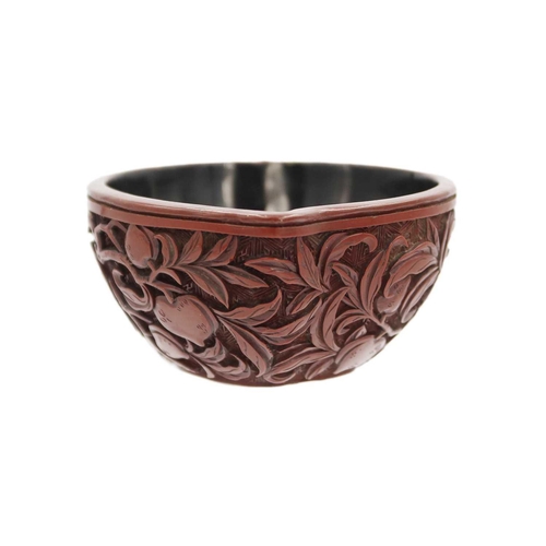 88 - A Chinese cinnabar lacquer libation cup, Qing Dynasty, 18th/19th century Carved with branches of fru... 