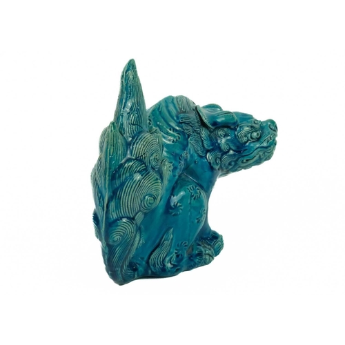 9 - A Chinese turquoise glazed pottery 'Lion' dog, circa 1900, late Qing Dynasty. The mythical beast in ... 