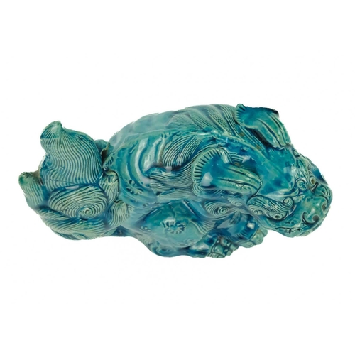 9 - A Chinese turquoise glazed pottery 'Lion' dog, circa 1900, late Qing Dynasty. The mythical beast in ... 