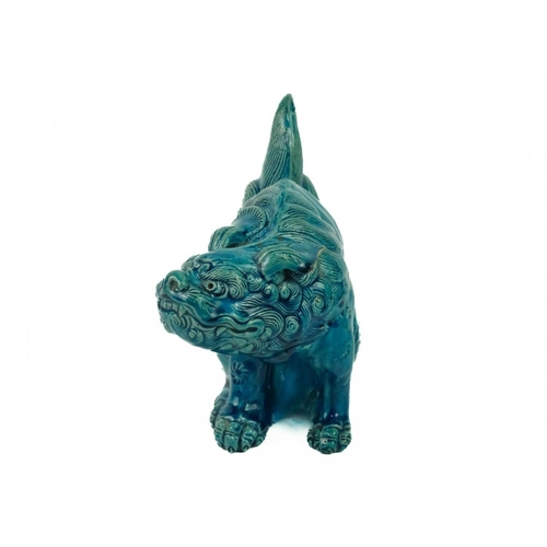 9 - A Chinese turquoise glazed pottery 'Lion' dog, circa 1900, late Qing Dynasty. The mythical beast in ... 