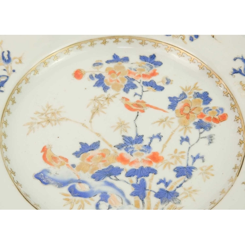 91 - A pair of Chinese export porcelain plates, 18th century. With birds perched on flowering branches, d... 