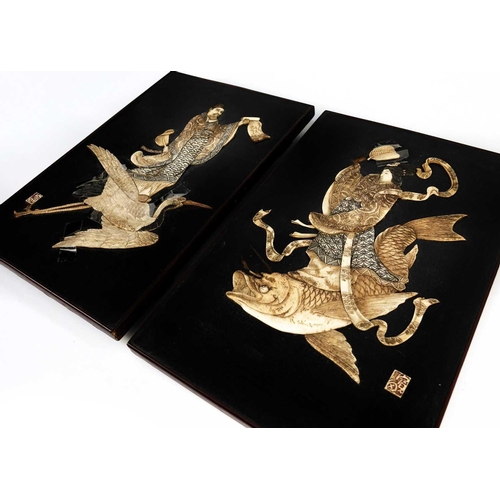 92 - A pair of Japanese bone decorated ebonised panels, Meiji period. Depicting figures upon the back of ... 