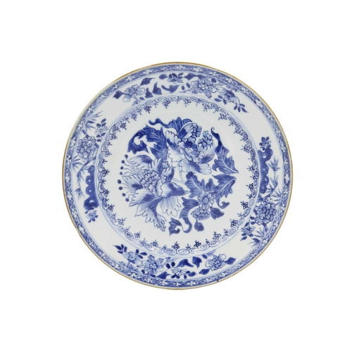 96 - A Chinese blue and white porcelain plate, Qianlong period, 18th century. With a large floral spray t... 