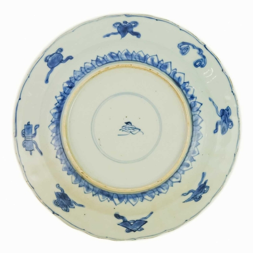 98 - A Chinese blue and white porcelain plate, Kangxi period, circa 1700. The centre painted with peony a... 