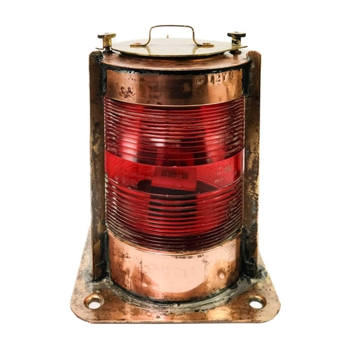 106 - A Belgian copper and brass ship's port side navigation lamp. With cylindrical red glass lens, height... 