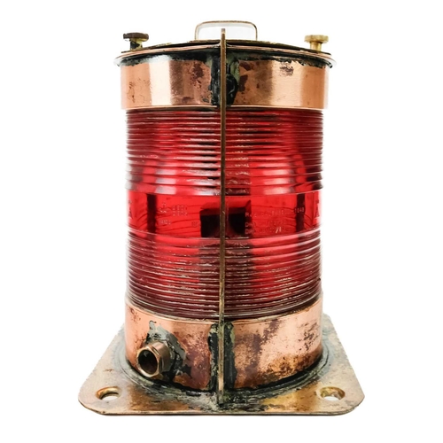 106 - A Belgian copper and brass ship's port side navigation lamp. With cylindrical red glass lens, height... 