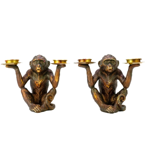 110 - A pair of resin tealight holders modelled as seated monkeys. Height 18cm. No condition issues.