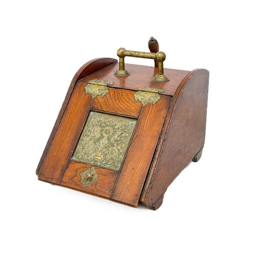 114 - A late Victorian aesthetic movement elm and brass coal scuttle. With inset square brass panel and ga... 