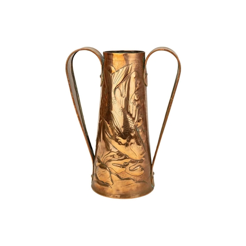 119 - A Newlyn copper twin handled vase. Of tapering form repousse decorated with fish amongst seaweed, st... 