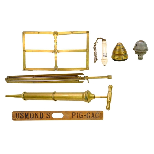 120 - An assortment of items. Comprising a J.F. Walters patent brass music stand, a large brass syringe, a... 