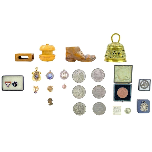 126 - A collection of badges and medallions, etc. Including a Ministry of Pensions King's Badge, a service... 