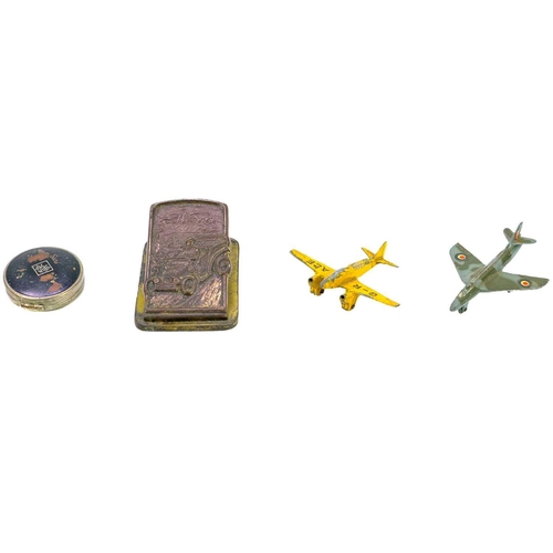 130 - A small box of miscellanea. Including a Dinky Hawker Hunter and a light racer diecast airplane, a se... 