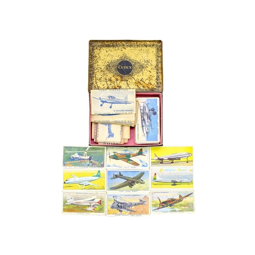 130 - A small box of miscellanea. Including a Dinky Hawker Hunter and a light racer diecast airplane, a se... 