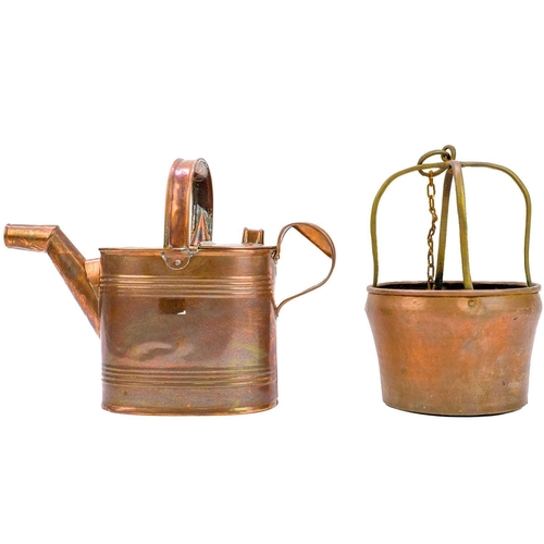 136 - A Victorian copper water can. Height 19cm, handle detached. together with two copper colanders and t... 