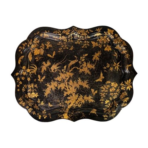 146 - A Victorian paiper mache lacquered serving tray. 82cm x 63cm together with another papier mache lacq... 