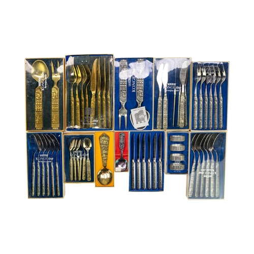 148 - Norwegian Konge tinn cutlery. Includes 12 cased sets together with a Jersey one pound coin.