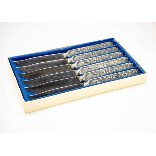 148 - Norwegian Konge tinn cutlery. Includes 12 cased sets together with a Jersey one pound coin.