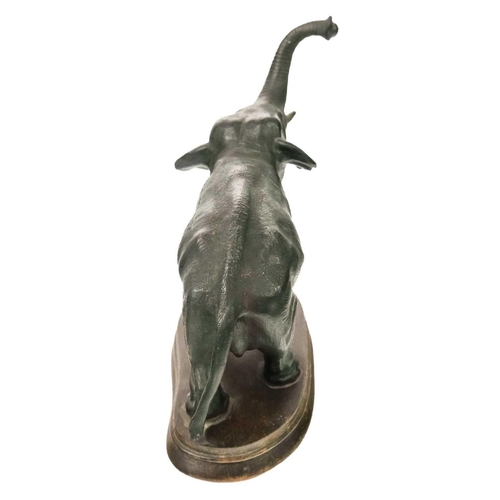 152 - A spelter figure of an Indian elephant. On oval oak base, height 20cm.